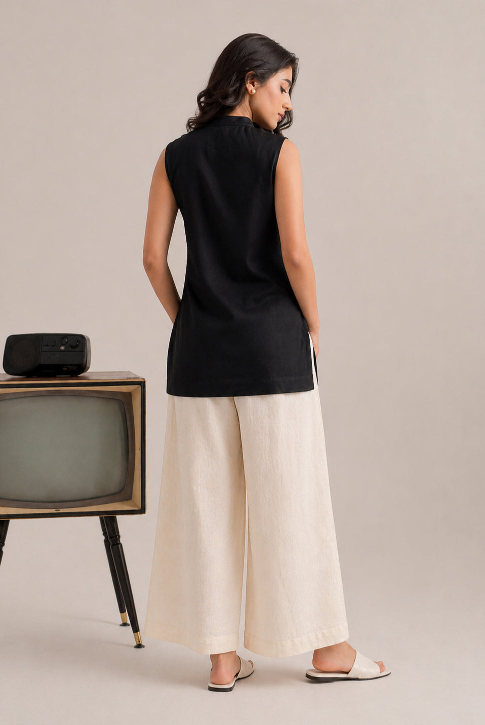 Laalzari midnight black sleeveless linen kurta and off-white palazzo set for women — styled look