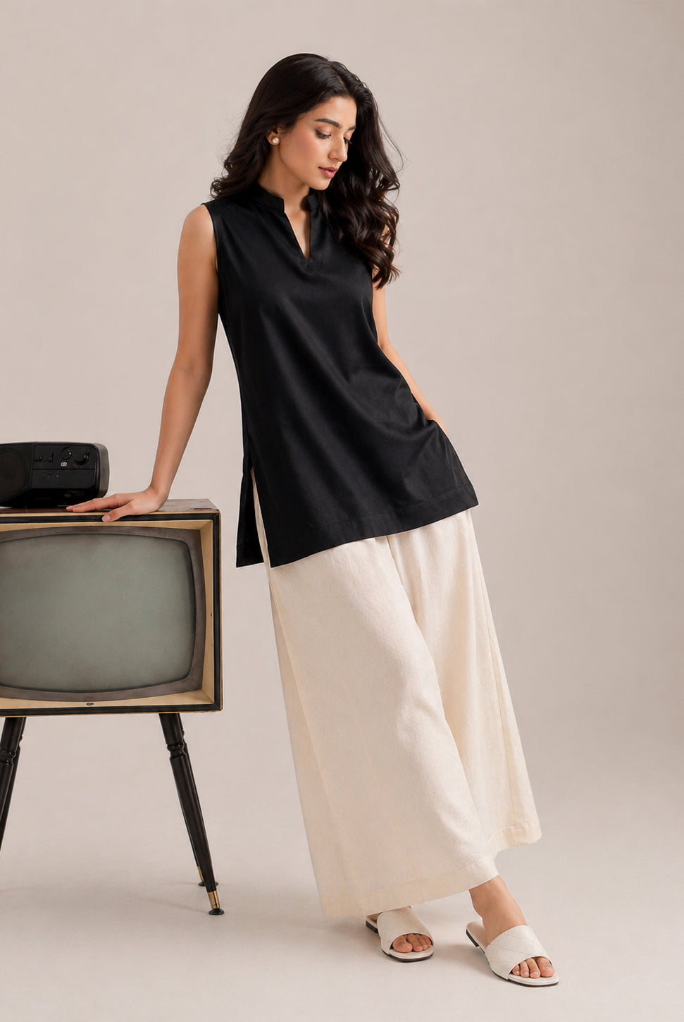 Laalzari midnight black sleeveless linen kurta and off-white palazzo set for women — full-length view