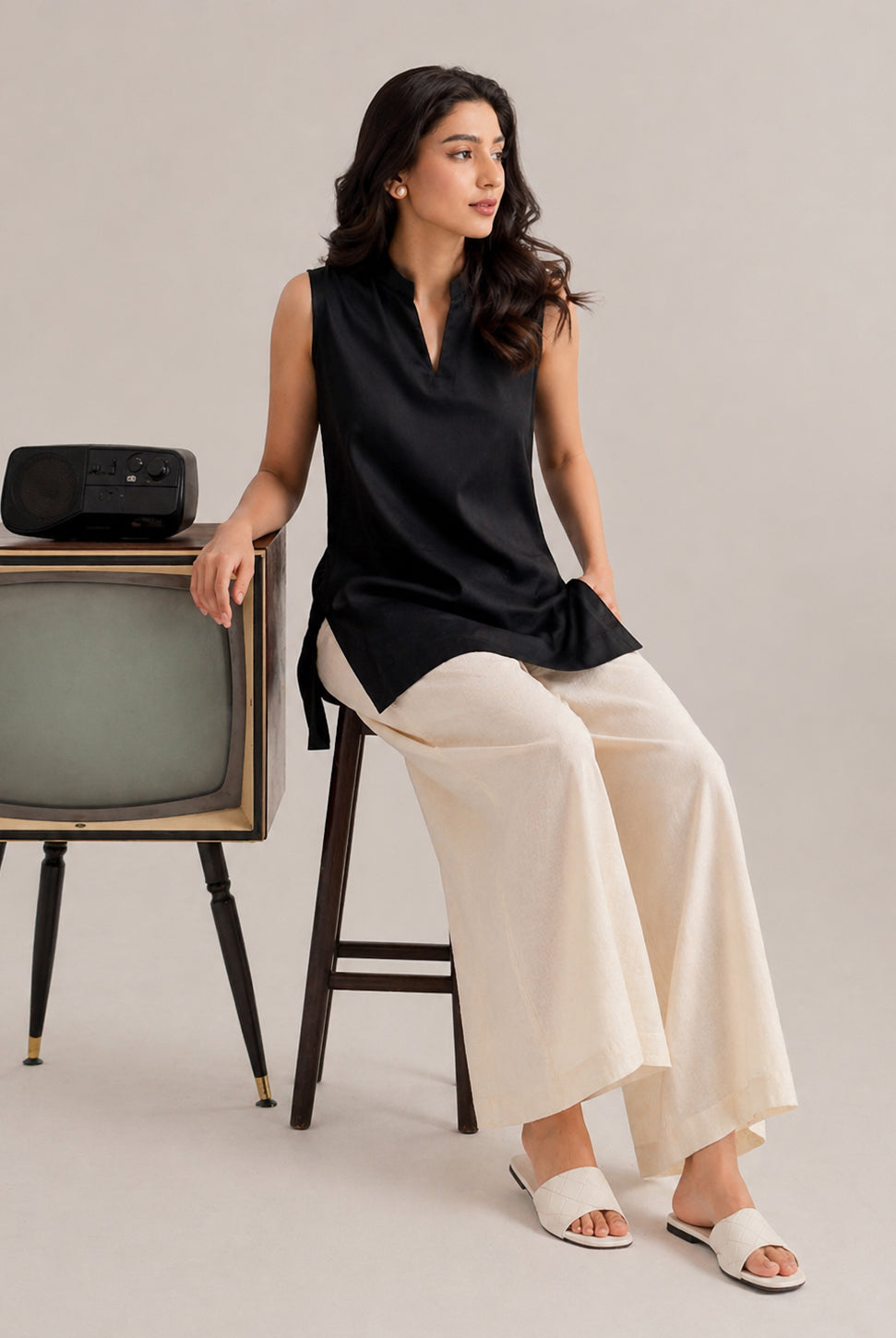Laalzari midnight black sleeveless linen kurta and off-white palazzo set for women — front view