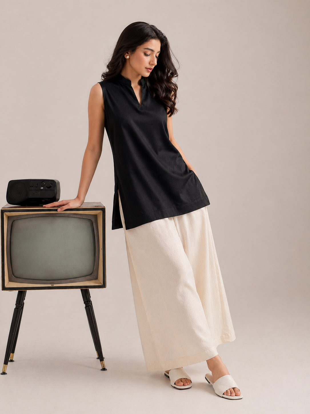 Laalzari midnight black sleeveless linen kurta and off-white palazzo set for women — full-length view