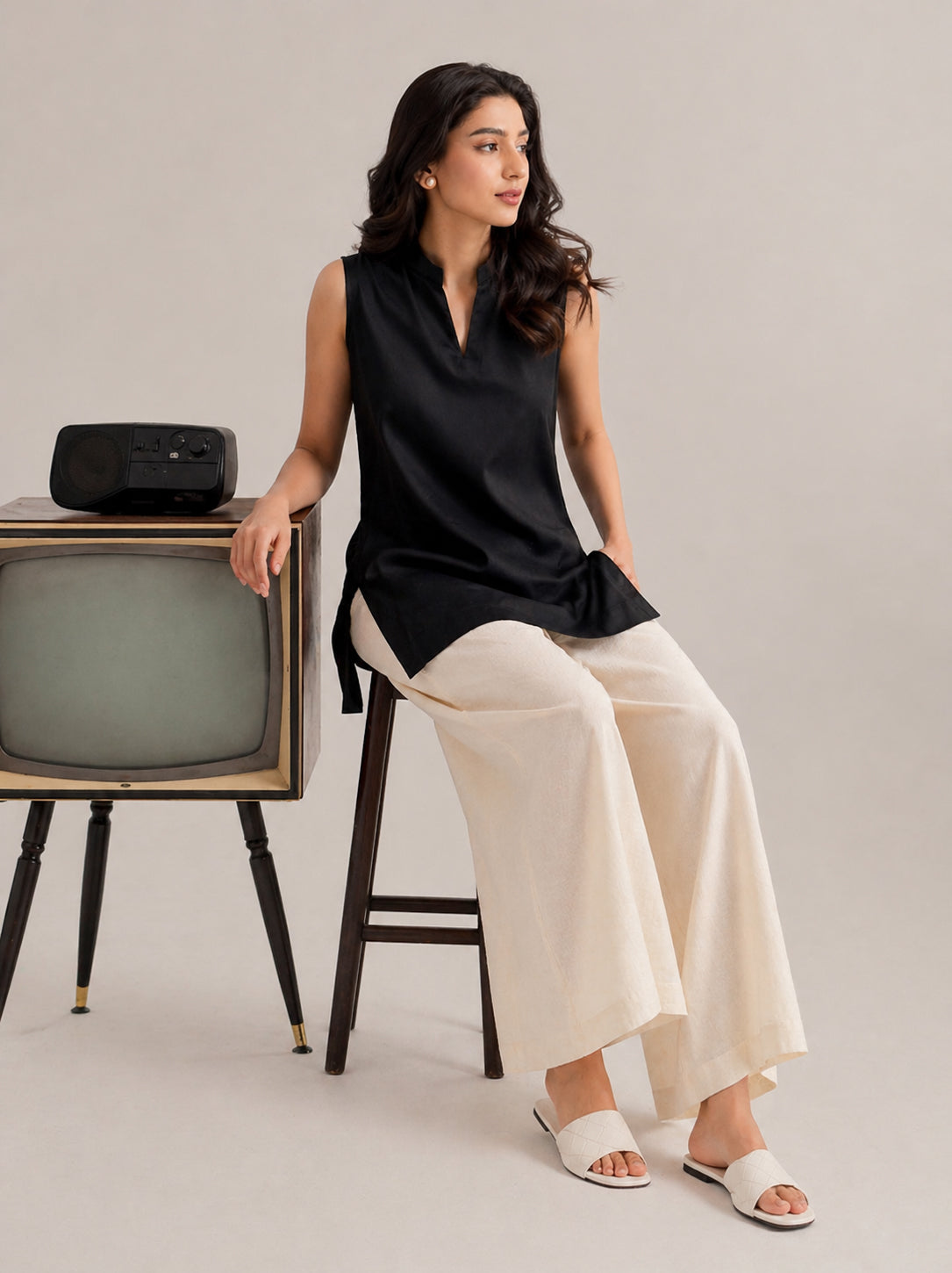 Laalzari midnight black sleeveless linen kurta and off-white palazzo set for women — front view